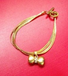 Pulseira Laço Dourada