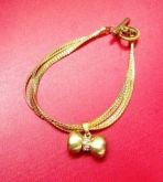 Pulseira Laço Dourada